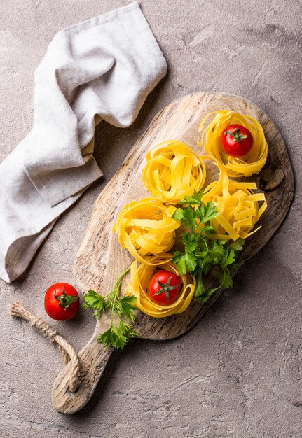 Raw pasta tagliatelle or fettuccine