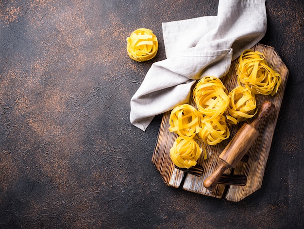 Raw pasta tagliatelle or fettuccine