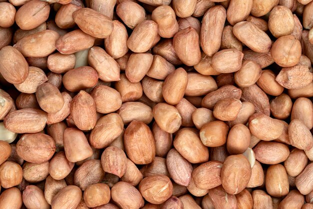 raw peanuts isolated on white background