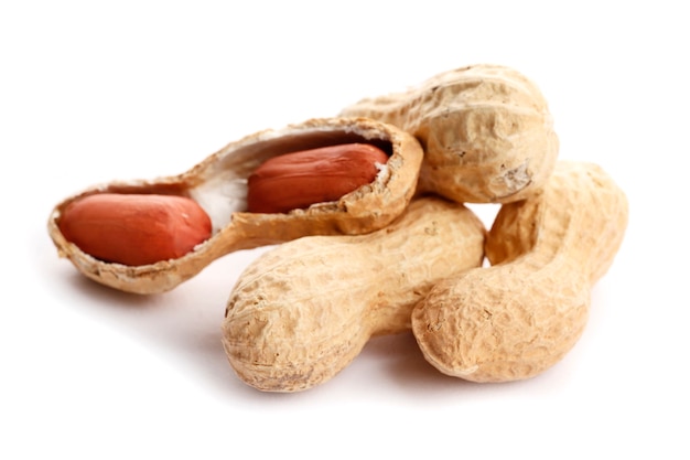 Raw peanuts on white background. Healthy snack ona white background. Top view. close-up.