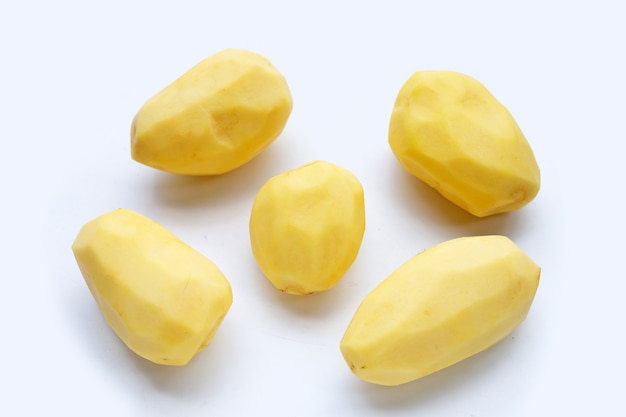 Raw peeled potatoes on white background