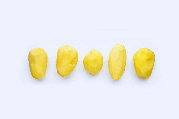 Raw peeled potatoes on white background