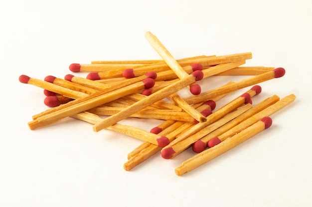 Raw pile of matches isolated on white background