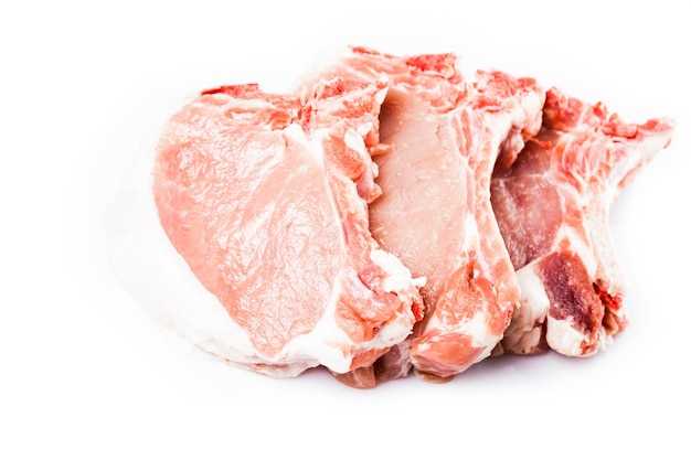 Raw pork loin slices isolated on white