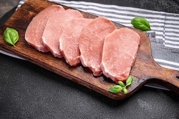 raw pork meat cut slice steak fresh meal food snack on the table copy space food background rustic