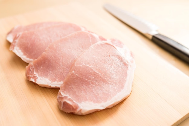 Raw Pork meat on cutting mat