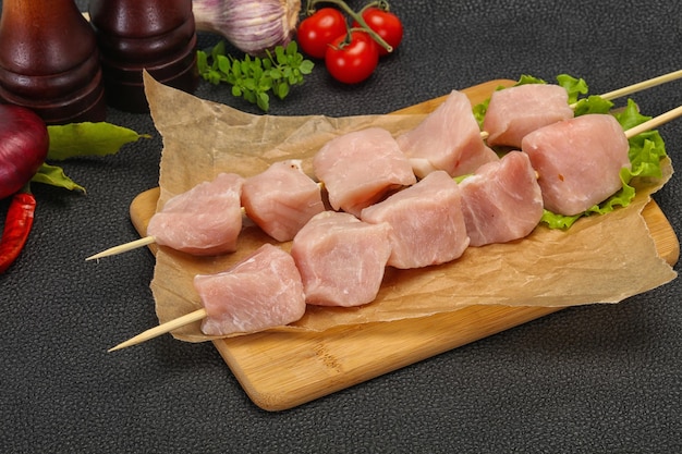 Raw pork meat skewer for grill