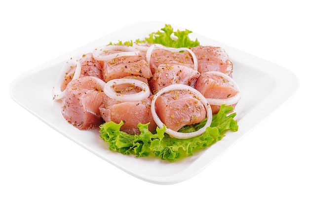 Raw pork meat with onions and spices for cooking kebabs