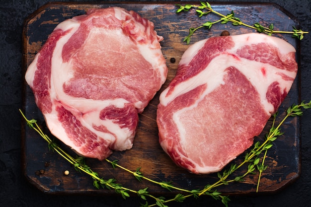 Raw pork meat on wooden table