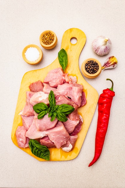 Raw pork neck, cut into pieces with fresh vegetables and dry spice