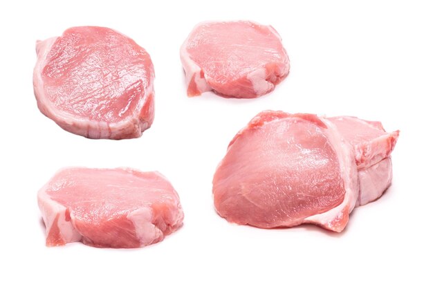 Raw pork pieces isolated on a white background Top view