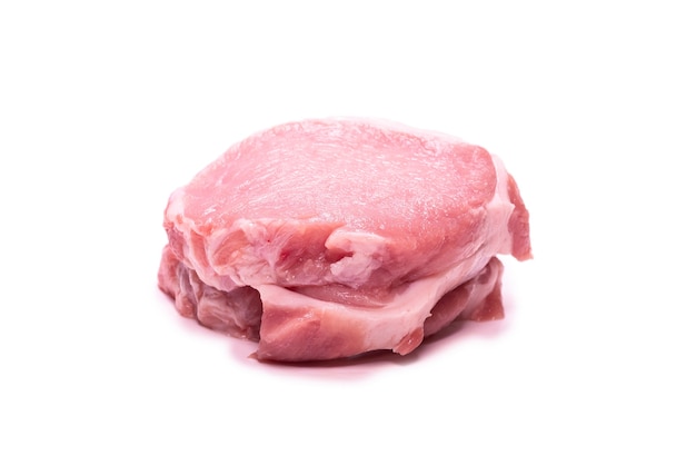 Raw pork pieces isolated on a white background. Top view.