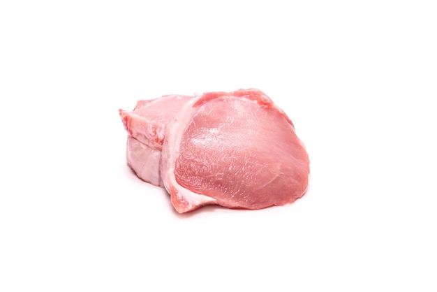 Raw pork pieces isolated on a white surface. Top view.