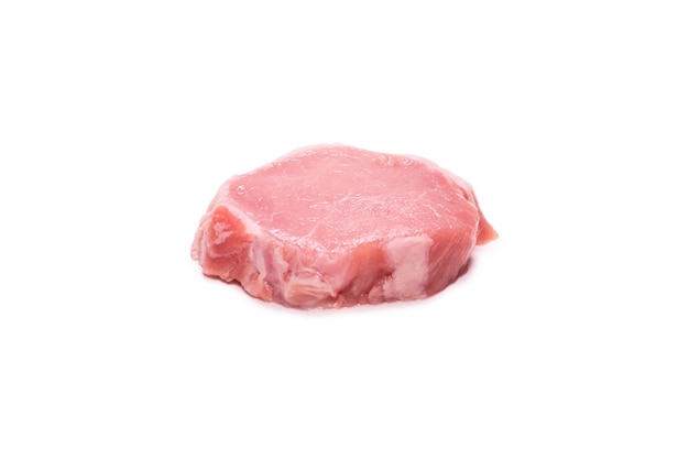 Raw pork pieces isolated on a white surface. Top view.