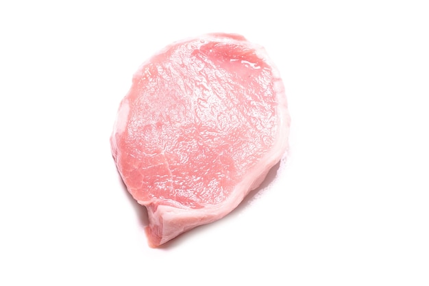 Raw pork pieces isolated on a white surface