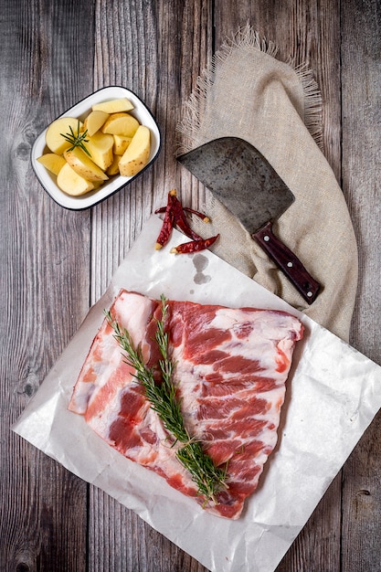 Raw pork ribs with herbs and spices ready for cooking 