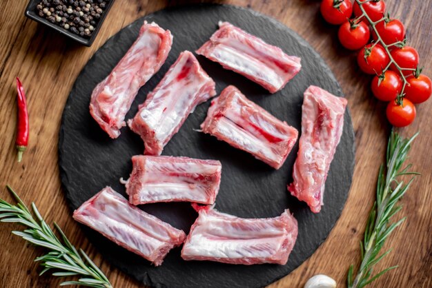 raw pork ribs on wooden background