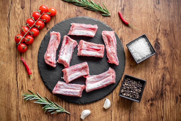 raw pork ribs on wooden background