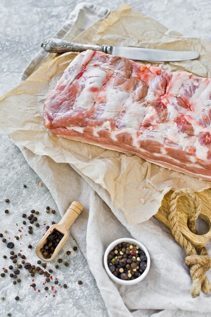 Raw pork ribs on a wooden chopping Board. 