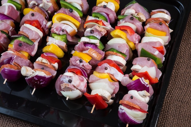 Raw pork skewers ready for grilling