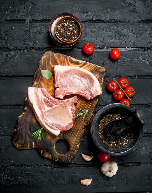 Raw pork steak on the bone with spices