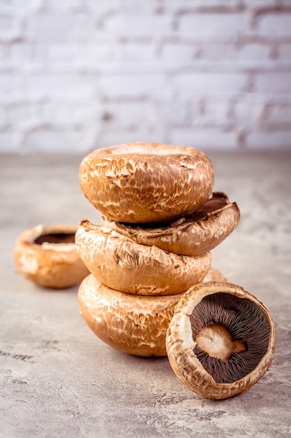 Raw portobello mushrooms on kitchen table prepared for cooking