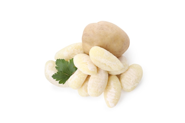 Raw potato gnocchi, potato and parsley isolated on white background