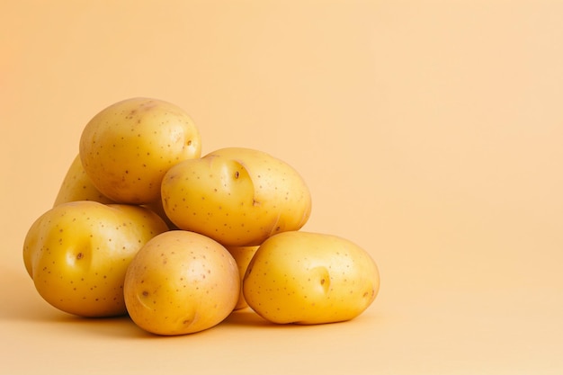 Raw potatoes Pile of fresh potatoes on neutral background with copy space for text Vegan diet healthy organic food vegetables salad preparation ingredients cooking vitamins