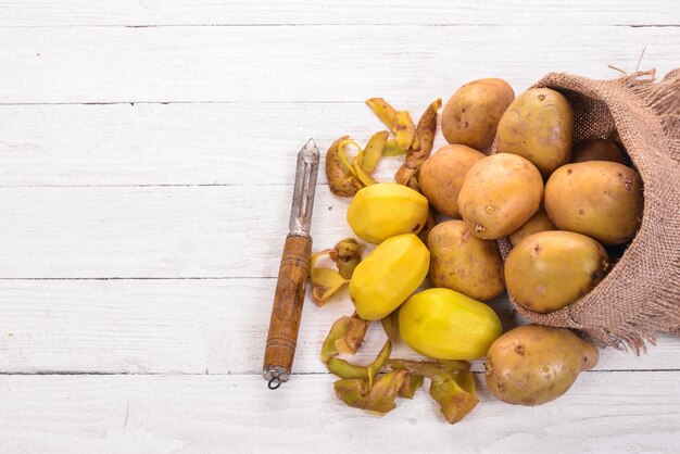 Raw potatoes On a white background Cooking Free space for text Top view