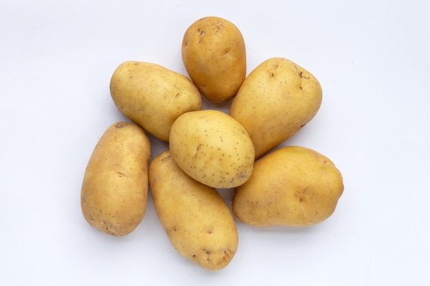 Raw potatoes on white background