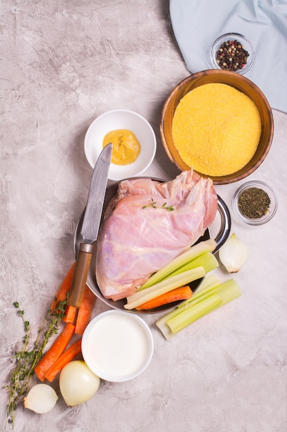 Raw rabbit legs and ingredients for dinner