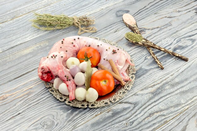 Raw rabbit on a wooden background