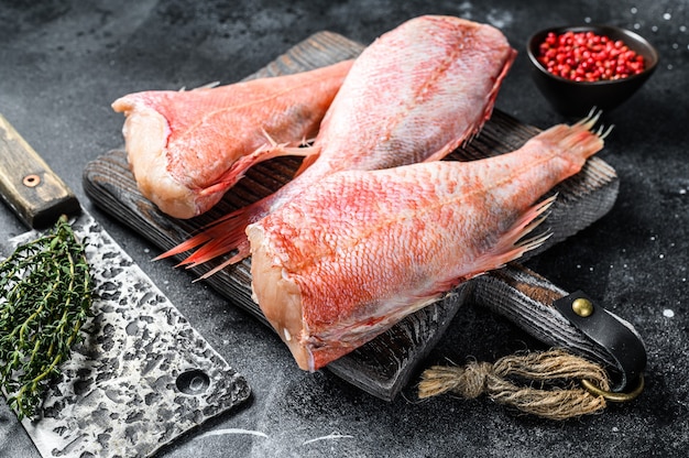 Raw Red perch or seabass fish on a cutting board.   Top view.