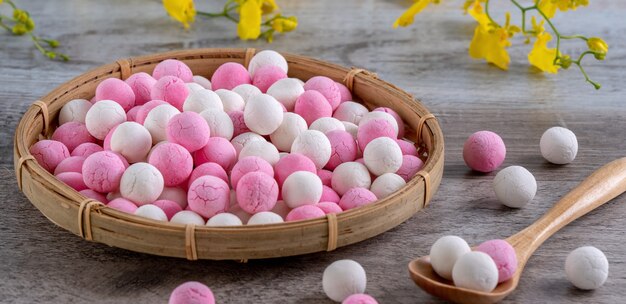 Raw red and white tangyuan glutinous rice dumpling balls. Winter solstice festival food.