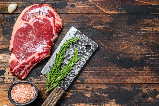Raw rib eye steak on the bone