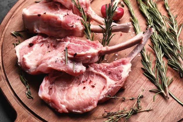 Raw ribs and seasoning on kitchen table