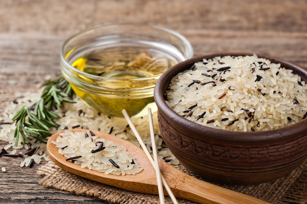 Raw rice grains on old background