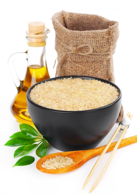 Raw rice grains on a white background