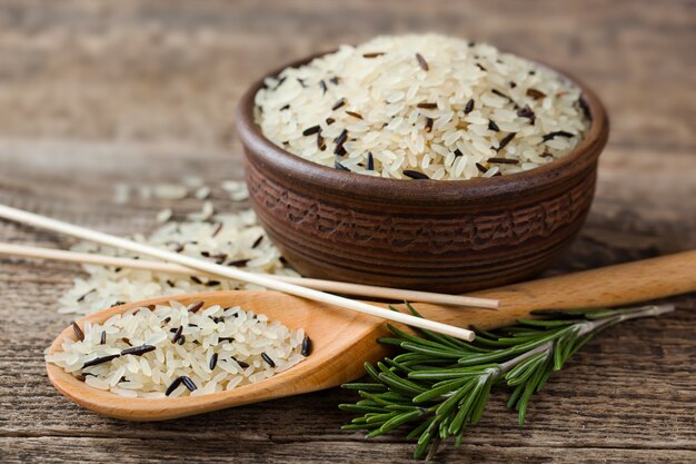 Raw rice grains on a white background