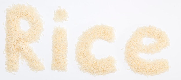 Raw rice on white surface