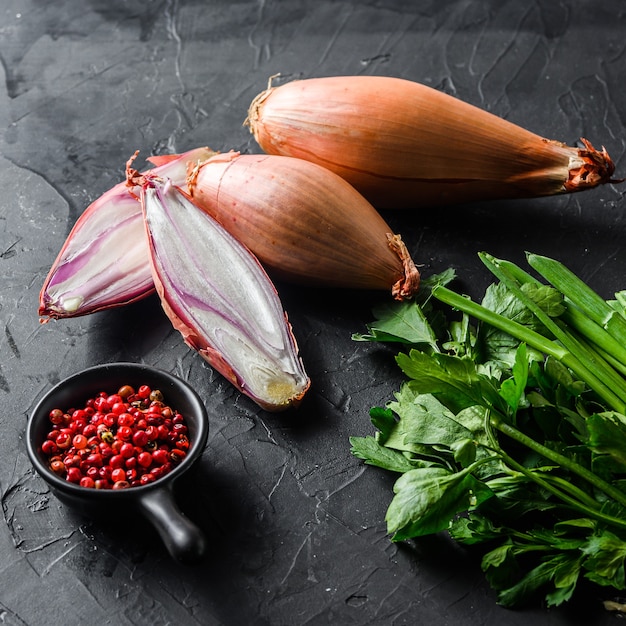 Raw ripe onions with greens