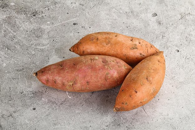 Raw ripe sweet potato heap for cooking