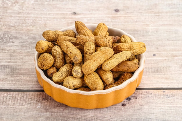 Raw ripe unpeeled peanut heap snack