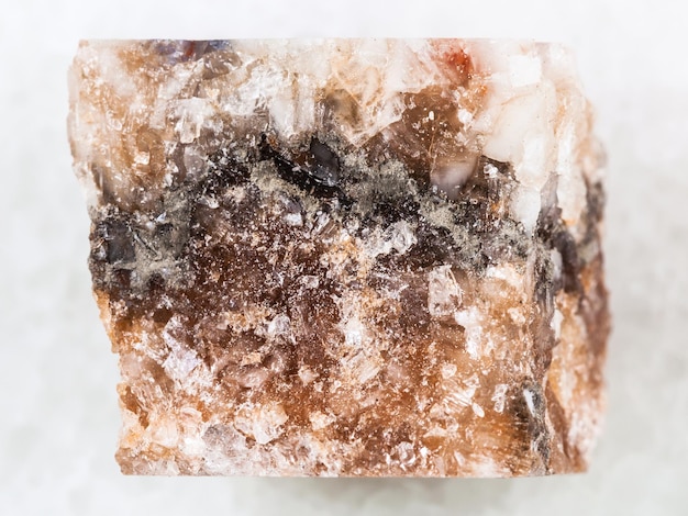 Raw rock salt halite on white