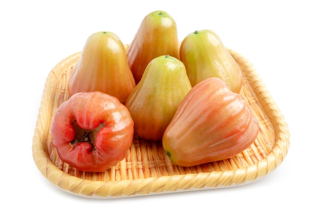 Raw Rose Apples or Chomphu named in Thai Thailand tropical fruit on plate isolated on white