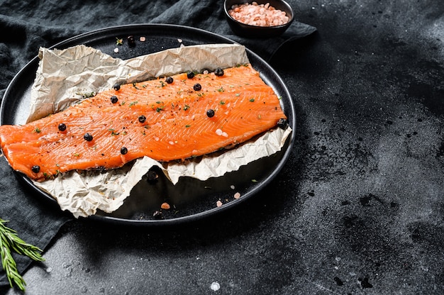 Raw salmon fillet on a table