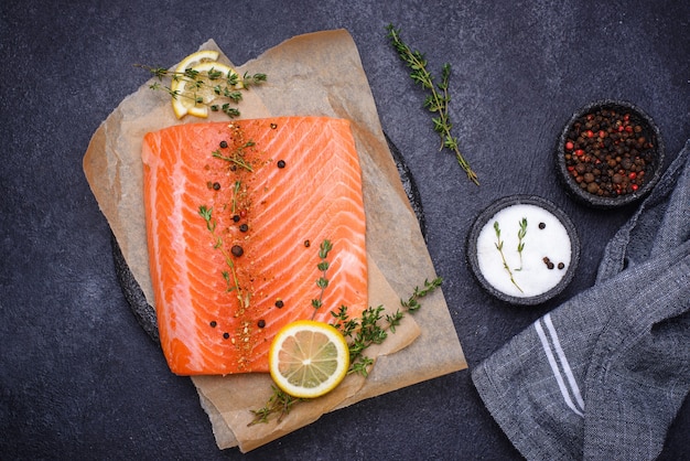 Raw salmon fillet with herbs