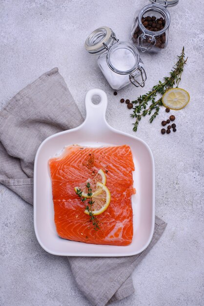 Raw salmon fillet with herbs