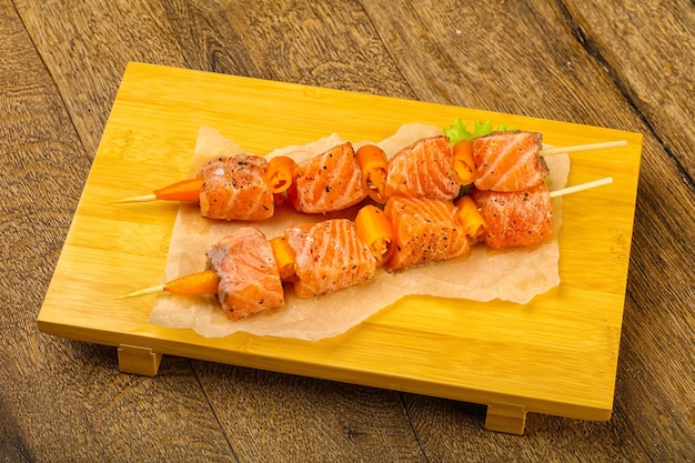 Raw salmon skewer