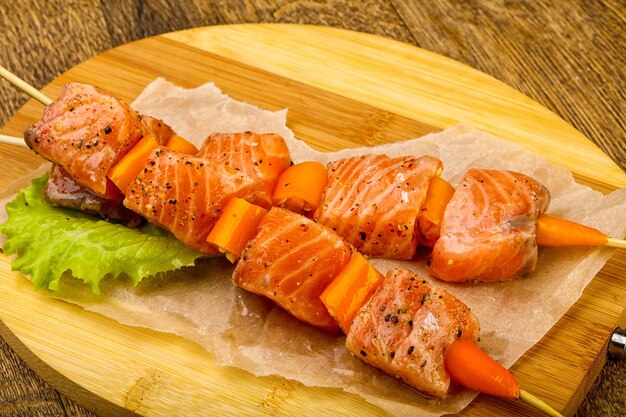 Raw salmon skewer